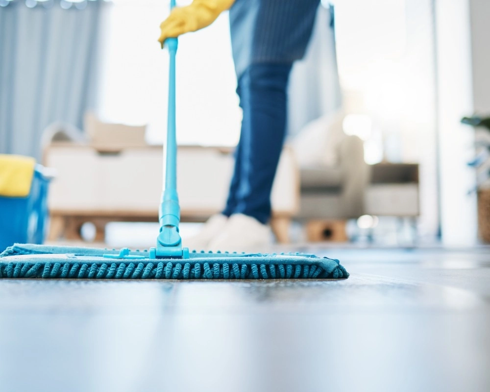 Brilliant Results Cleaning professional dusting a ceiling fan in a Valparaiso home